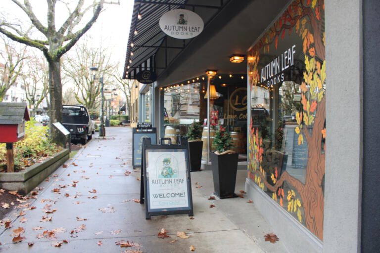 A sign on Northeast Fourth Avenue in downtown Camas directs shoppers to the Autumn Leaf bookstore, on Saturday, Nov. 23, 2024. Autumn Leaf is one of several downtown Camas businesses taking part in the post-Thanksgiving shopping events designed to promote local, independently owned businesses in Camas' historic downtown shopping and dining district.