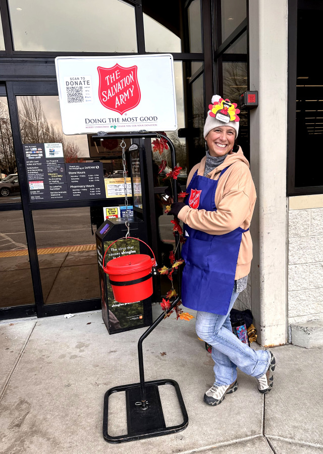 Top: Camas-Washougal Salvation Army volunteer Tonette Sweet rings a bell in November 2024.