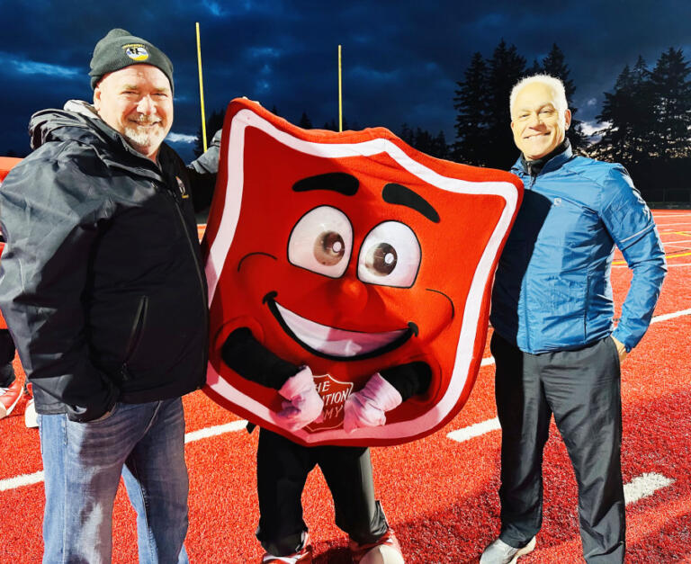 Washougal Mayor David Stuebe (left), Camas-Washougal Salvation Army employee Kendra Taggart (center) and Camas City Council member Tim Hein attend the 2024 Camas-Washougal Salvation Army Red Kettle Kickoff, Nov.