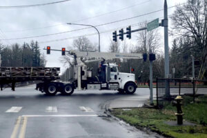 A truck drives through the intersection of Northeast 13th and Northwest Friberg-Strunk streets in Camas, near the site of a proposed gas station, car wash and convenience store development, March 4, 2024. (Kelly Moyer/Post-Record files)