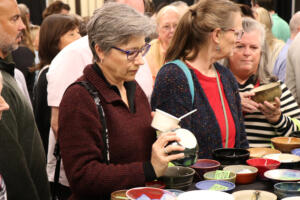 An attendee looks at a handmade bowl during the Empty Bowls Camas event, held at the AWPPW Local 5 building in Camas, Sept. 17, 2024. (Contributed photos courtesy of Jamie St. Clair)