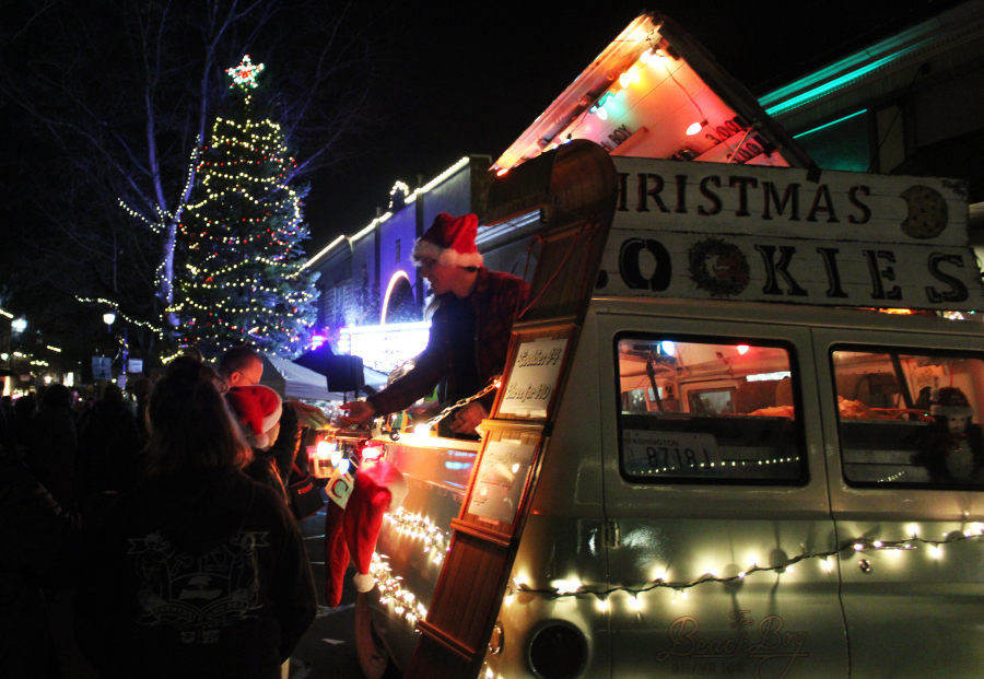 Visitors to the 2024 Hometown Holidays celebration in downtown Camas buy cookies following the city of Camas&rsquo; annual tree lighting event, Dec. 6, 2024.