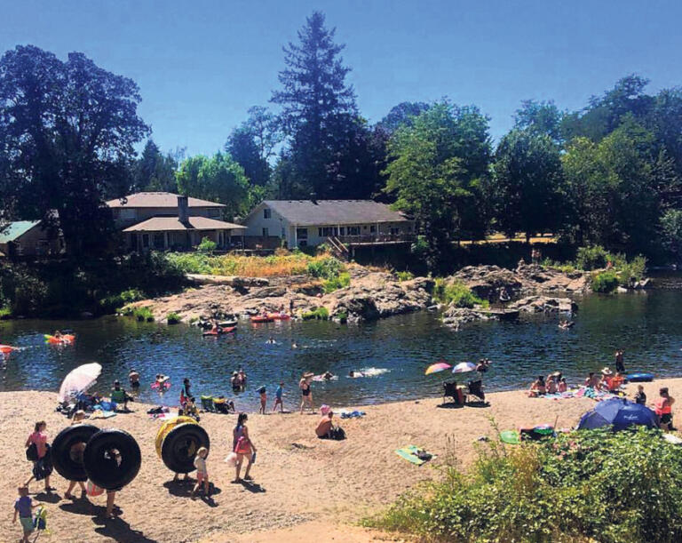 Visitors prepare to float and swim in the Washougal River at the Sandy Swimming Hole in Washougal in July 2018. The city of Washougal will soon begin work to widen Shepherd Road and provide safer access to the popular swimming spot.