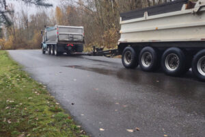 Trucks drive up Southeast 356th Avenue in Washougal on Nov. 20 2024. (Contributed photo courtesy of Rachel Grice)