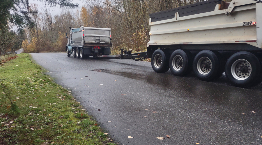 Trucks drive up Southeast 356th Avenue in Washougal on Nov. 20 2024. (Contributed photo courtesy of Rachel Grice)