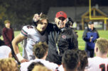 Camas coach Adam Mathieson stands with Beau Harlan (12) as he talks to his team after beating Skyview in a 4A Greater St. Helens League football game at Kiggins Bowl on Friday, Nov. 1, 2024. (Tim Martinez/The Columbian)