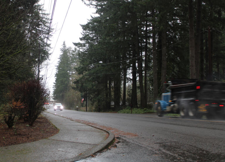 Vehicles travel on Northeast 13th Street  in Camas, near the site of a proposed gas station-car wash-convenience store project, on Thursday, Dec. 12, 2024.