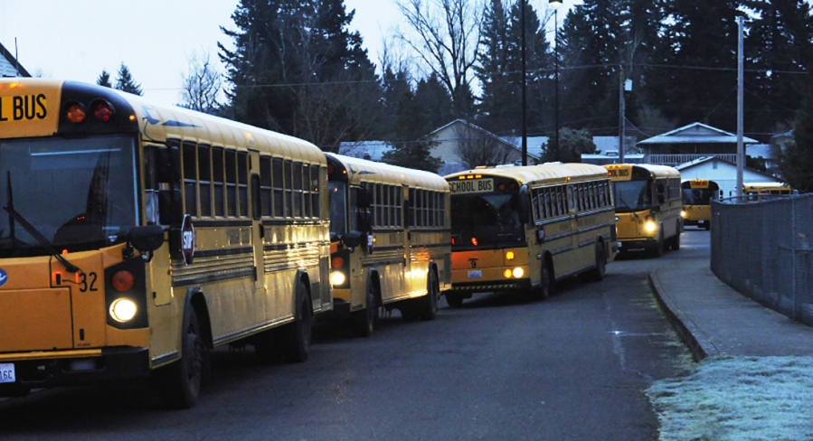 School buses sit outside Washougal High School in 2018. Local school districts faced revenue shortfalls in 2024. (Post-Record files)